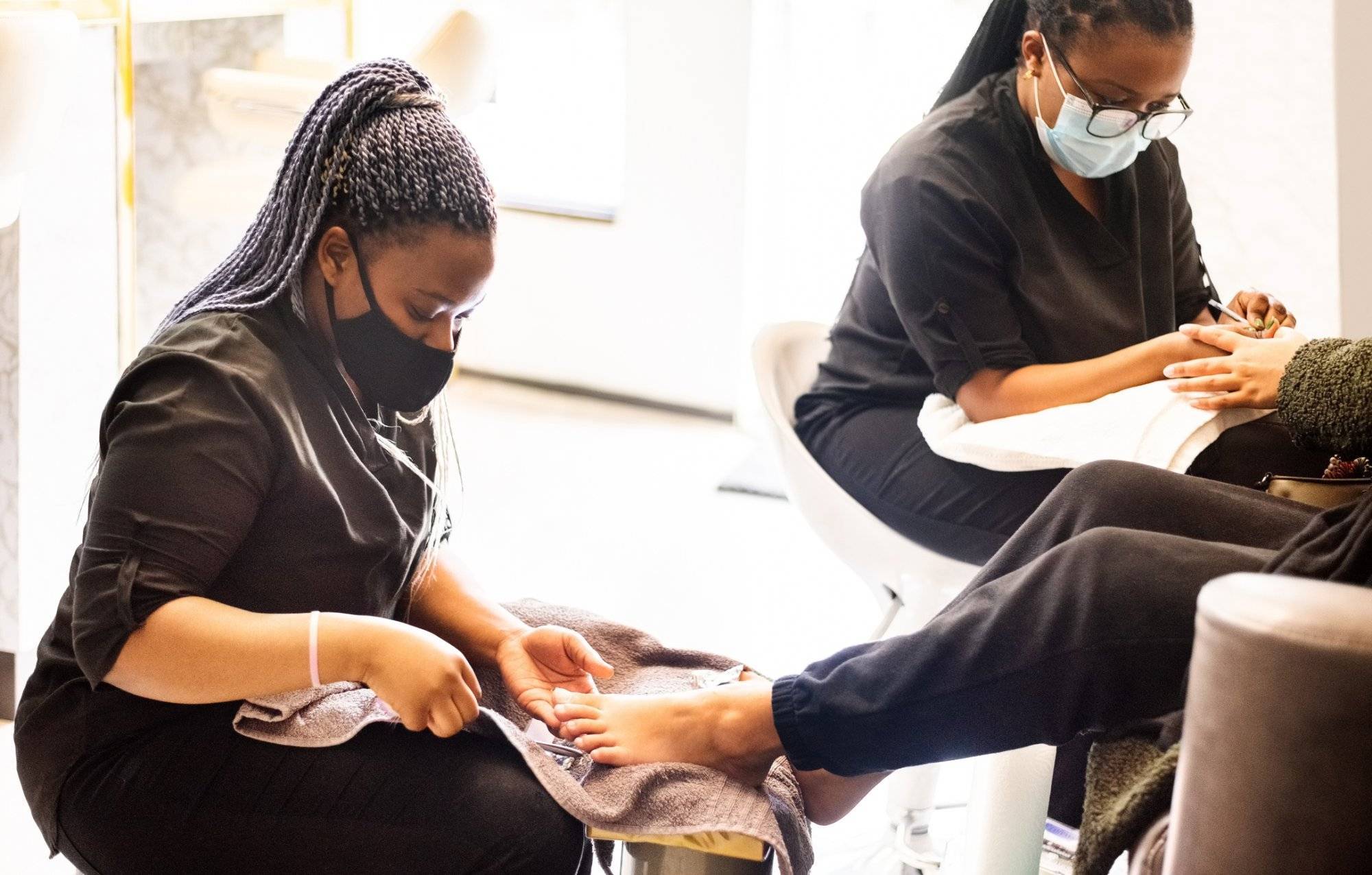 Woman having pedicure and manicure at beauty spa during pandemic Prep for Labor Day in Garland at Northstar Plaza